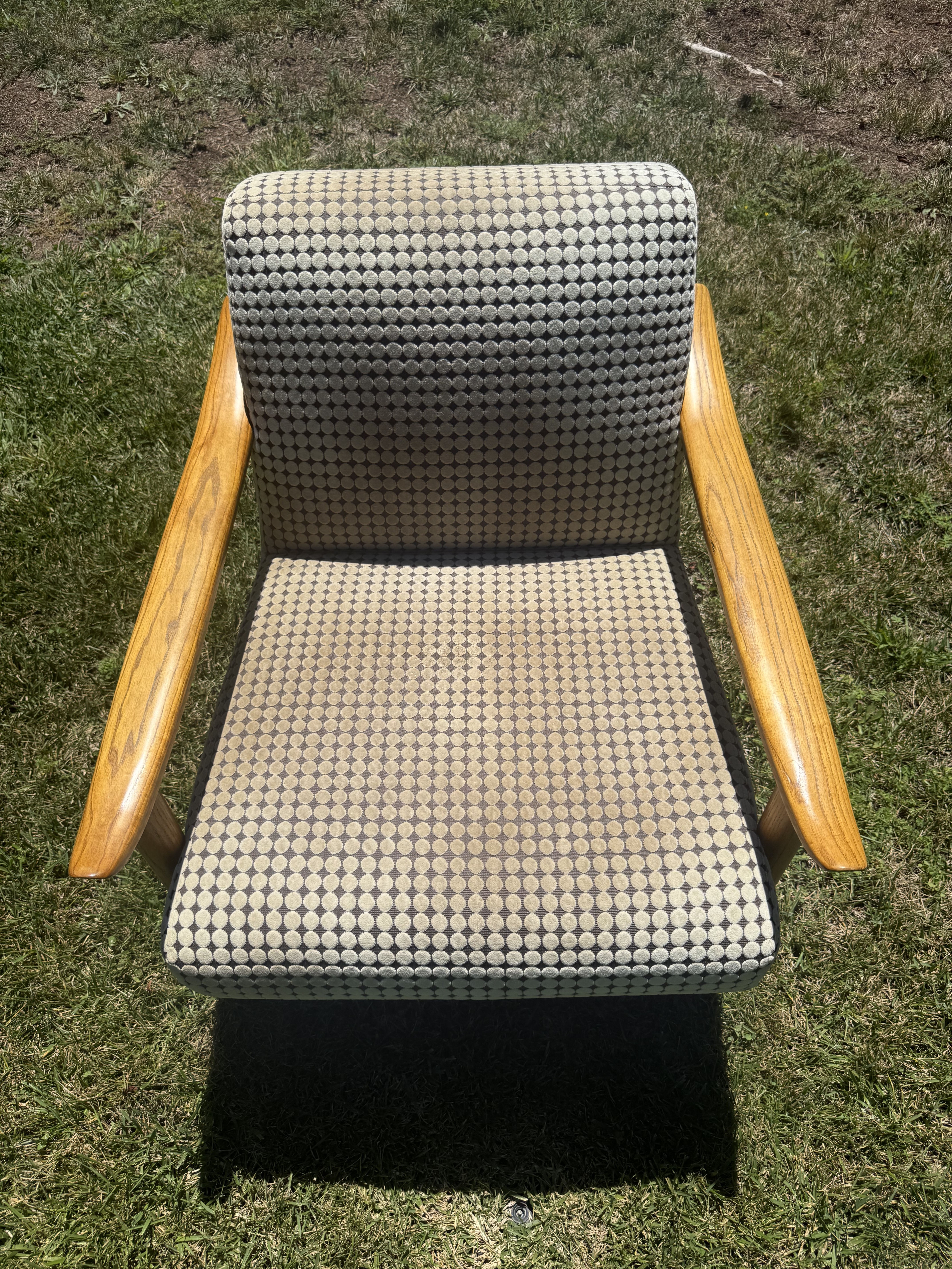 Patterned armchair before Avelo upholstery treatment