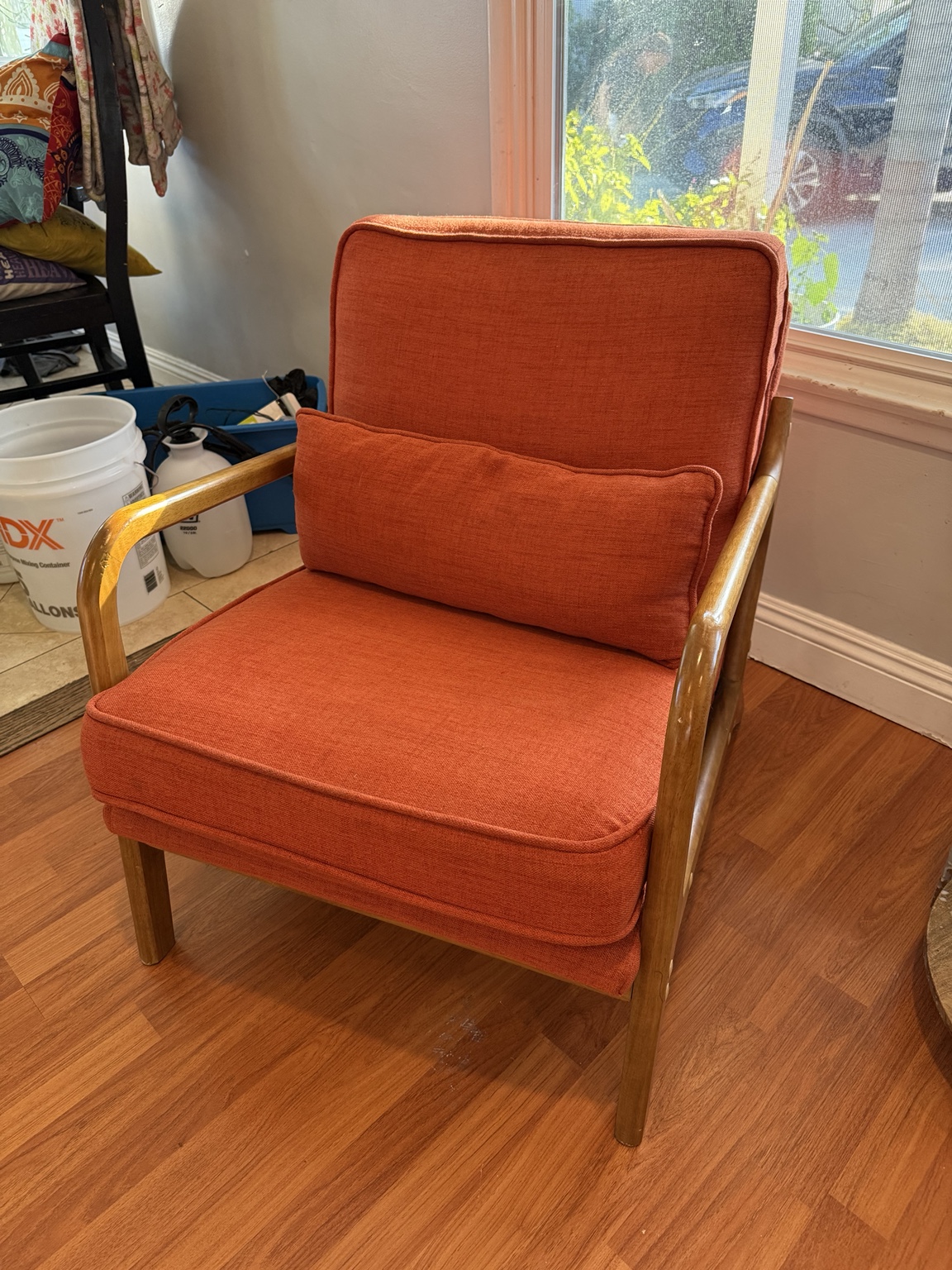 Orange upholstered chair after Avelo treatment