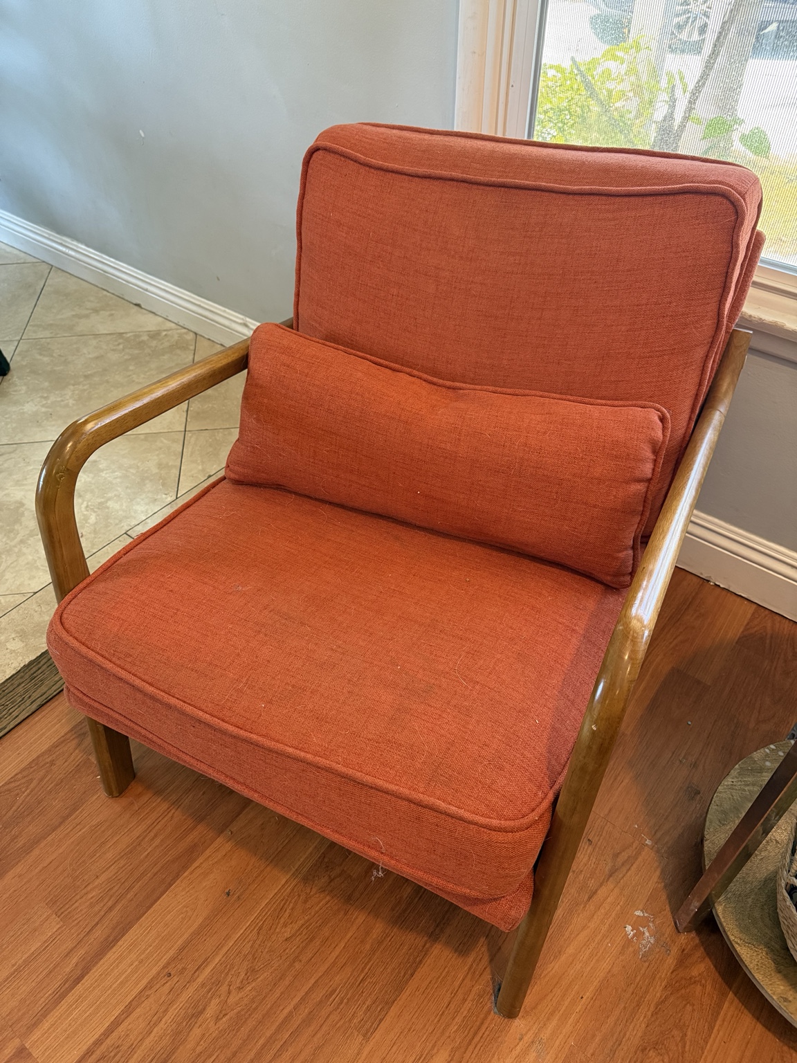 Orange upholstered chair before Avelo treatment